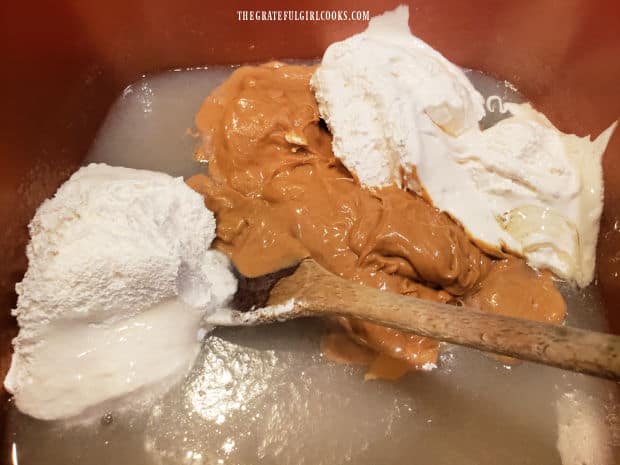 Creamy peanut butter and marshmallow creme are stirred into the sugar and milk syrup.