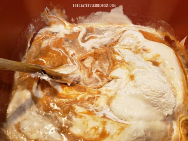 Peanut butter fudge ingredients being mixed in saucepan before pouring into dish.