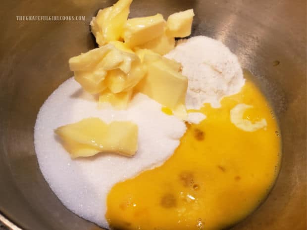 Flour, sugar, softened butter and an egg are combined in a medium bowl.