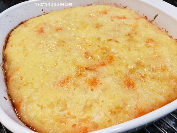 Once baked, the pineapple topped sweet potato puff is golden brown and rises slightly in dish.