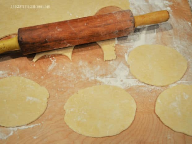 Dough for cannoli is rolled, then cut into circles before they are molded onto tubes and fried.