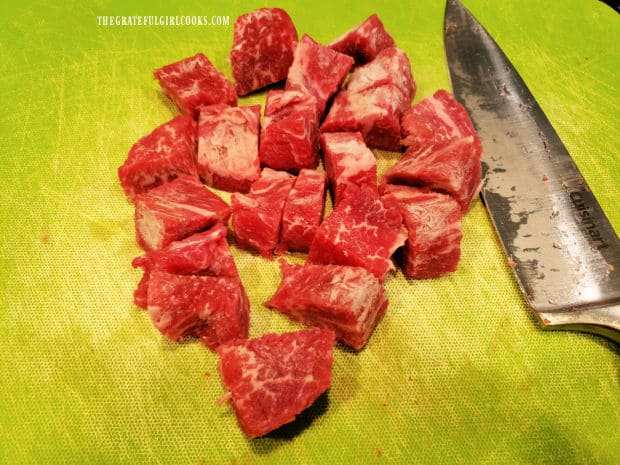 A one pound steak is cut into bite sized bites before cooking.