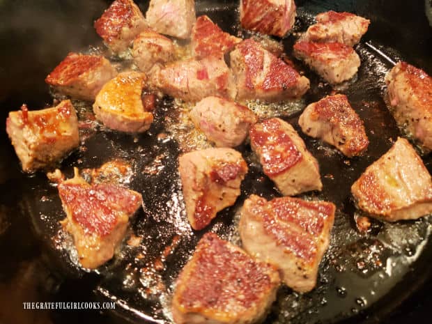 Pan-searing the steak bites produces a nicely browned exterior crust on the meat.