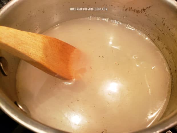 Cooking the lemon sauce in a medium saucepan until bubbling.