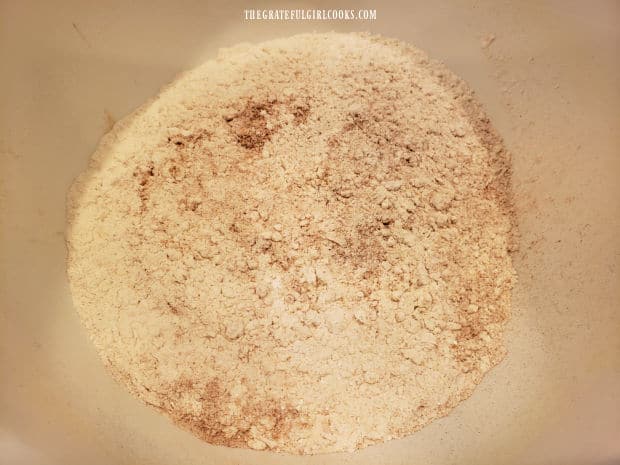 The dry ingredients for the gingerbread pancake batter are combined in a large bowl.