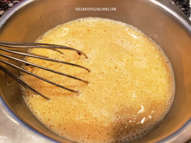 Eggs, molasses, milk, etc. are combined, becoming the wet ingredients for the pancake batter.