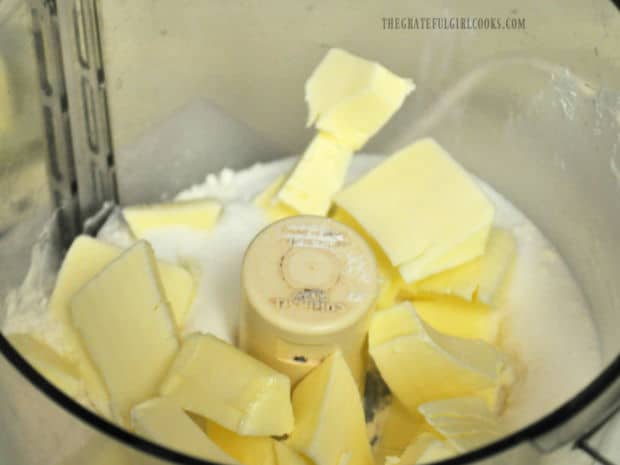 Cold butter for the crust is mixed with sugar and salt in a food processor.