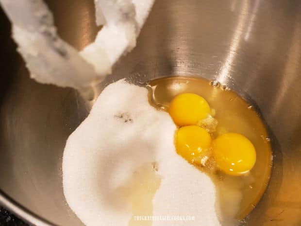 Eggs and sugar are beaten with an electric mixer until sugar dissolves.