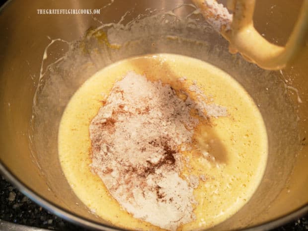 Flour, cinnamon, nutmeg, cloves and other ingredients are added to the pumpkin batter.