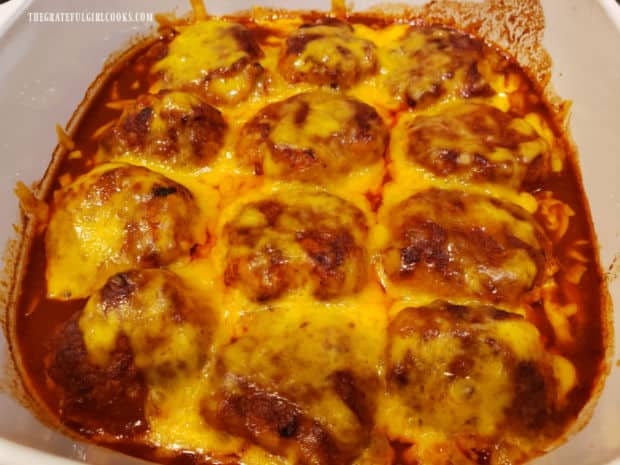 Chicken Enchilada Meatballs, covered with melted cheese, after baking 20 minutes.