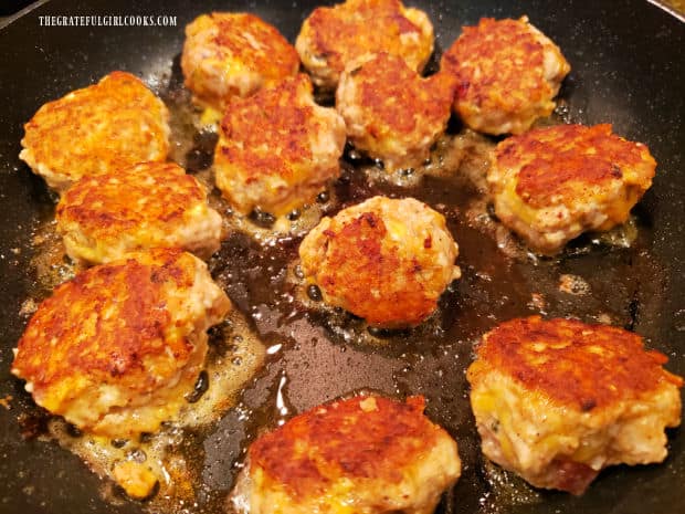 All 12 meatballs are browned on all sides in the skillet, then removed.