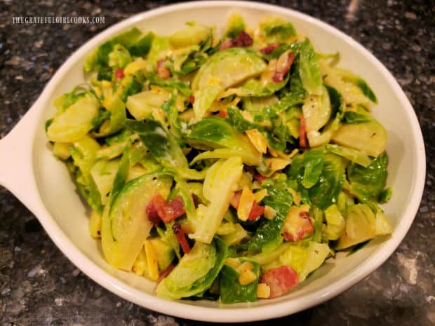 The combined brussel sprout mixture is placed in small, greased baking dish.