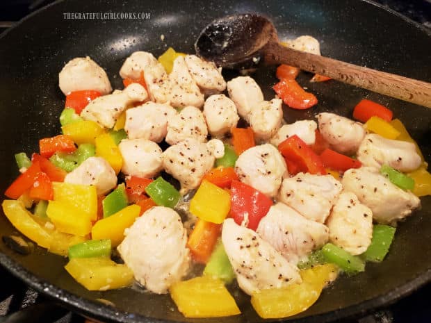 The chicken and bell peppers are lightly seasoned with salt, pepper, and onion powder.