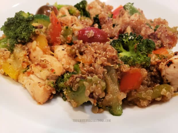 Chicken, Quinoa and Veggies, served in a white bowl.