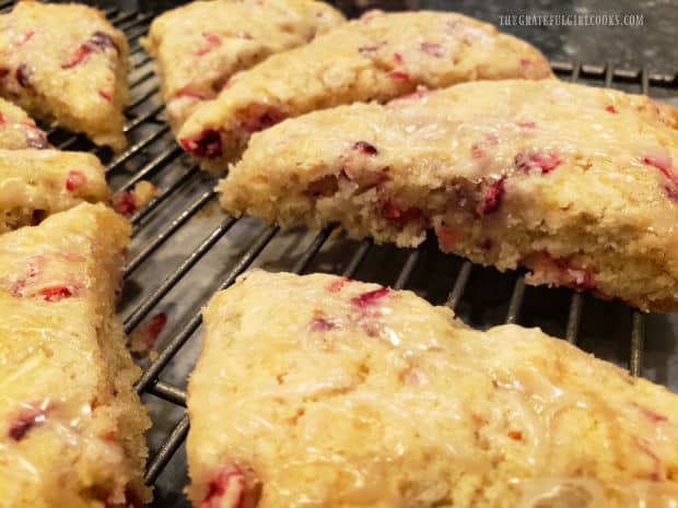 Once glaze hardens, cranberry apple scones are cut into wedges, then are ready to be enjoyed.