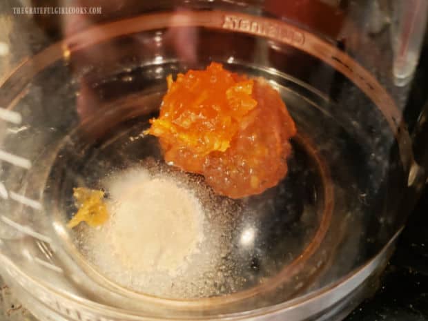Orange marmalade and sugar are placed in the coffee pot before brewing coffee.