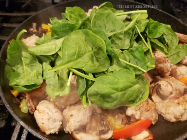 Fresh baby spinach is added to the skillet and cooked only until wilted.