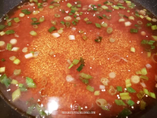 Asian-inspired couscous cooks in a covered skillet on low heat in sauce until liquid is absorbed.