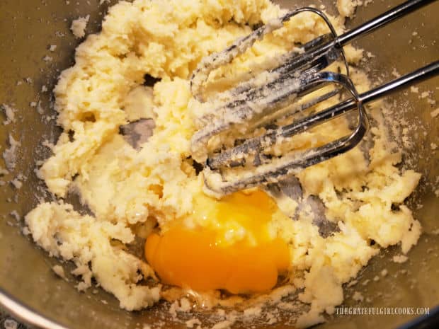 Eggs are added, one at a time to the butter mixture.
