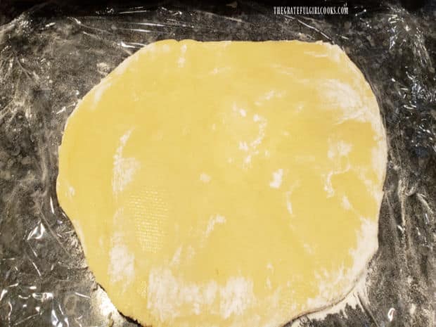 Dough for shamrock cookies is covered with plastic wrap and refrigerated two hours until firm.