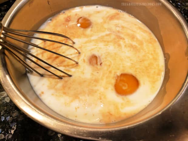 Eggs, milk, maple syrup and vanilla extract are whisked together until combined.
