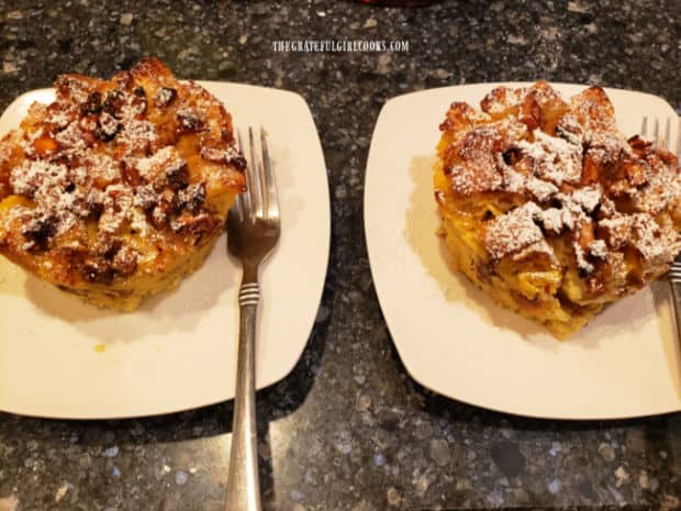 Apple Pecan French Toast Cups are removed from ramekins, then dusted with powdered sugar.