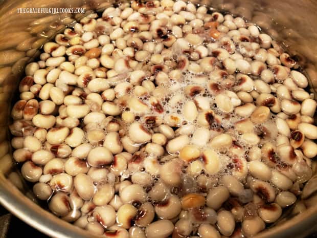 Blackeyed peas are cooked in boiling water according to package directions.