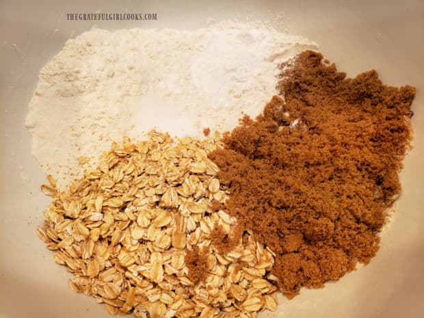 Dry ingredients for the muffins are measured into a large mixing bowl.