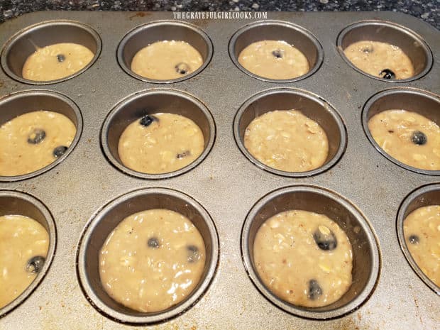 Banana blueberry oat muffins are baked for 18-20 minutes in muffin tin.
