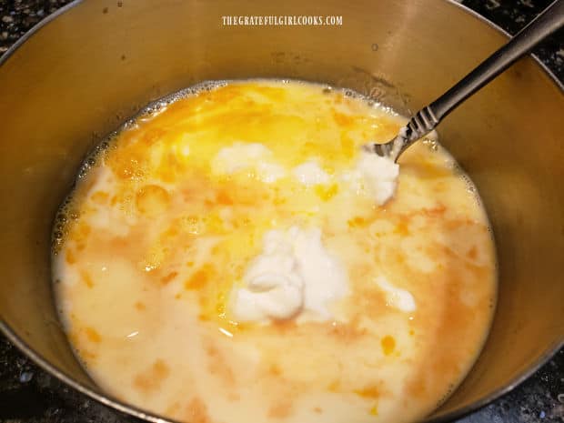Eggs, milk, Greek yogurt, vanilla and oil are mixed together in a separate bowl.