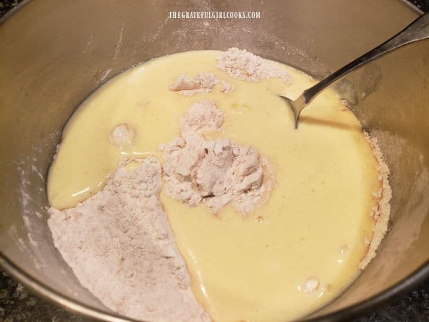 Wet ingredients are added to the bowl of dry ingredients and it's mixed until smooth.