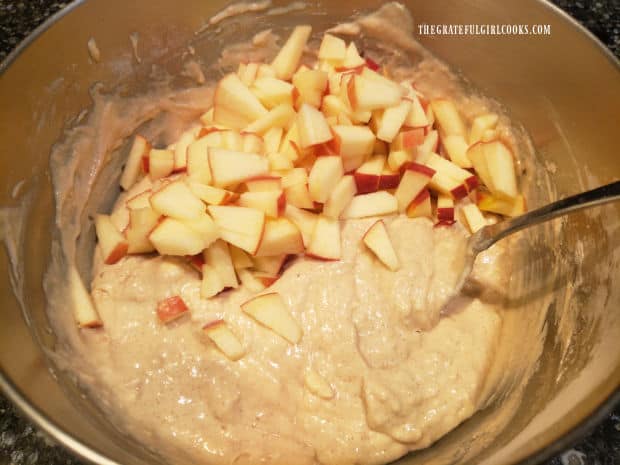 Diced apples are added to the thick batter for the pancakes.