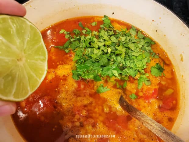 Chopped cilantro and the juice from a lime are added to the Mexican red lentil soup.
