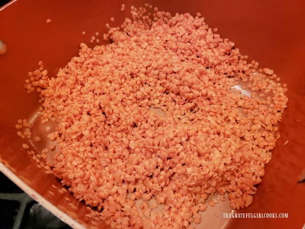 After rinsing several times, the red lentils are ready to be cooked in more water.