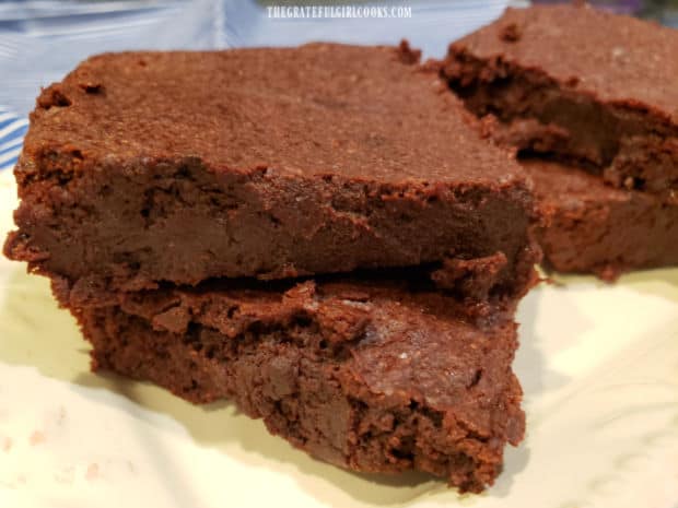 A close up of mocha cinnamon brownies, dense and fudgy, and ready to be enjoyed.