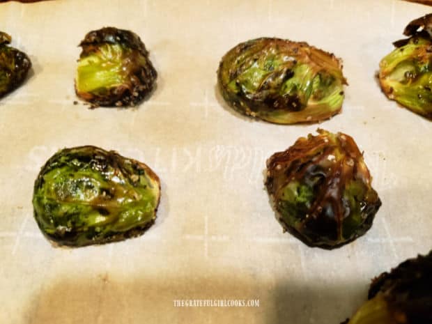 Crispy, charred outer leaves cover the green, tender roasted Brussel sprouts.