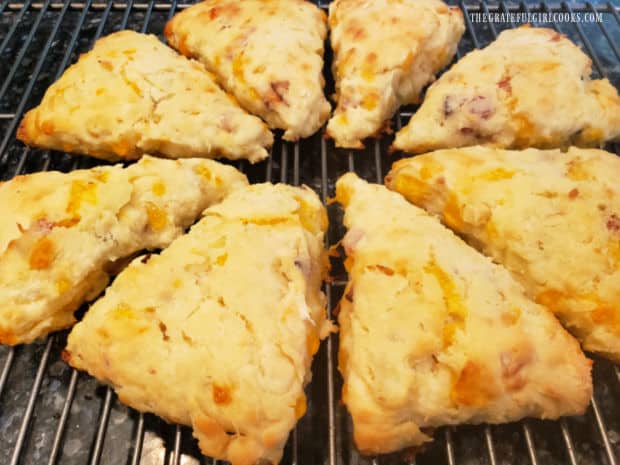 The bacon apple cheddar scones cool on a wire rack after baking.