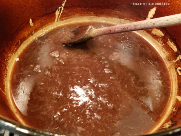 Red wine sauce is cooked with butter until slightly thickened.