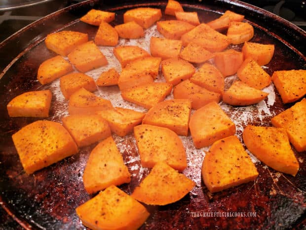 A pan of roasted curry sweet potatoes, hot out of the oven.