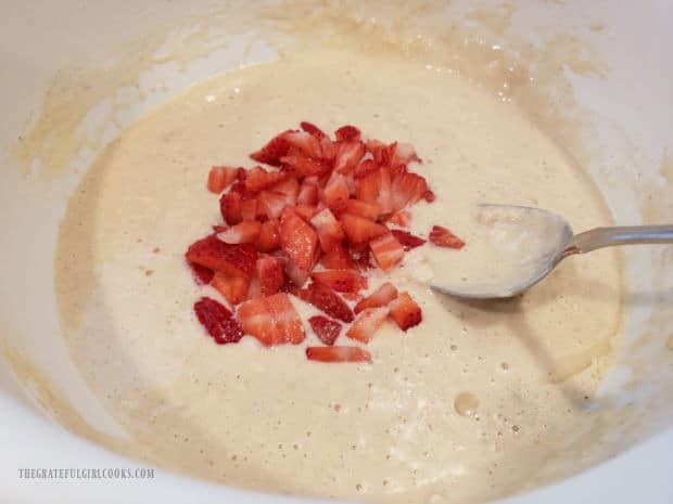 Chopped fresh strawberries are added to the pancake batter.