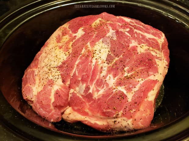 Pork but is dried, seasoned and then placed in a slow cooker for 8 hours cooking on low.