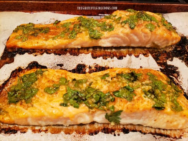 Garlic lime baked salmon is cooked and ready to transfer to plates.