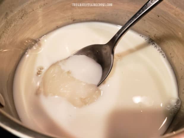 Sugar, milk, corn syrup and salt are cooked on Low heat in a saucepan.