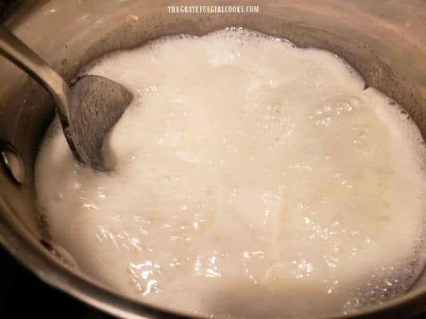 Ice cream sauce base boils as it cooks, prior to adding peanut butter.