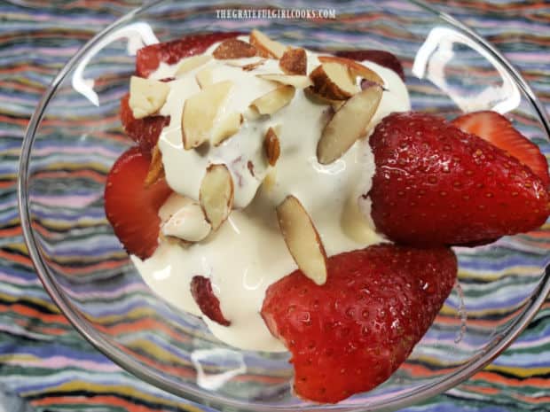 Almond whipping cream and toasted, sliced almond top the sundae.