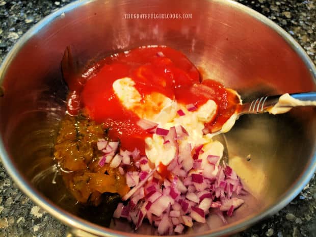 Ingredients for thousand island salad dressing are measured into a bowl.