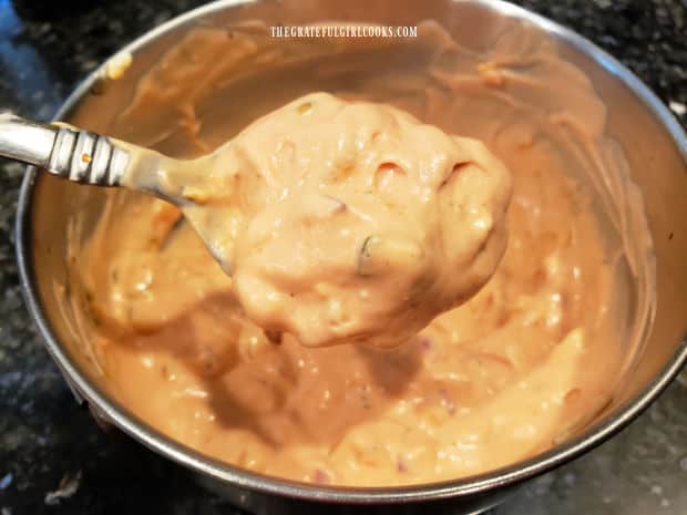 A spoonful of thousand island salad dressing shows how thick it is.