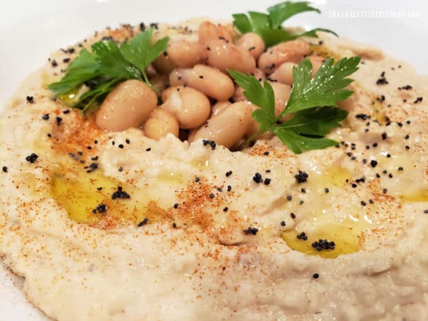 Classic cannellini bean dip, garnished and ready to serve with chips or crackers.