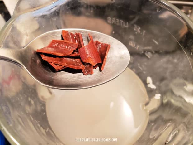 Rice, water and broken cinnamon sticks are blended together, after soaking.