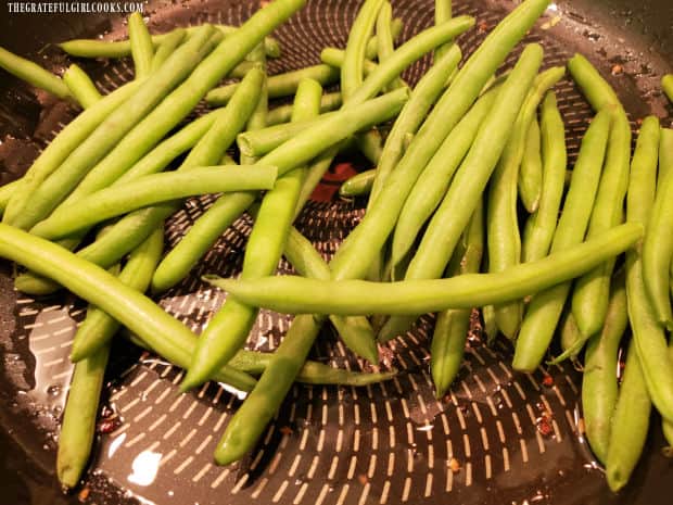 Fresh green beans are pan-seared in bacon drippings left in skillet.